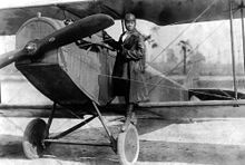 220px-Bessie_Coleman_and_her_plane_(1922)